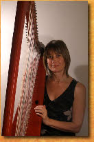 Frances Kelly and her Cherry Red Large Italian Triple Harp